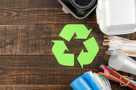 Eco symbol. recycling. Eco concept on brown wooden table. waste recycling. top view.の写真素材