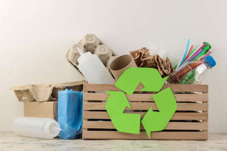 Eco symbol and trash in the box. recycling. waste recycling. on a light backgroundの写真素材