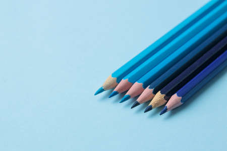 composition with blue pencils on a bright blue background. close-up. place for text.の写真素材