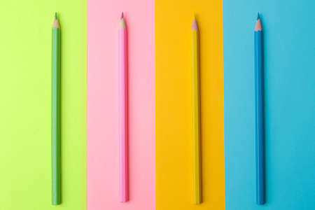 Composition with colored pencils on a colorful trendy background. top viewの写真素材