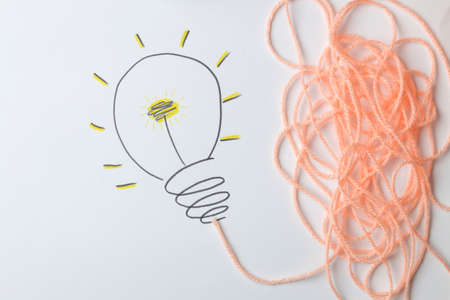 Concept creative idea. concept of creative idea. painted light bulb on a light background. metaphor, inspiration.の写真素材