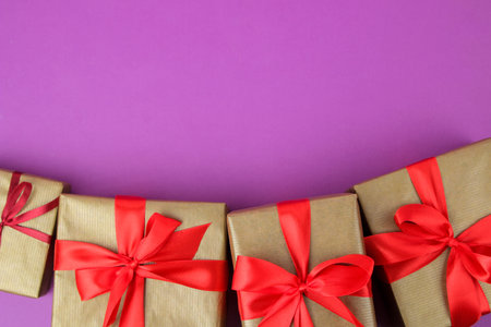 Gift boxes. Gifts on a bright purple background. Holidays. Valentine's Day. women's day. mother's...