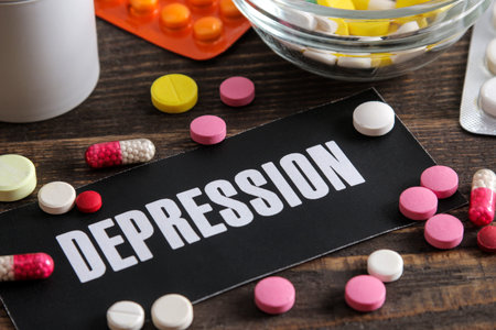 Depression concept. inscription depression on paper and pills on a wooden brown table.