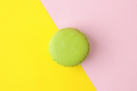 Macarons french multicolored macaroons cakes. small french sweet cake on a bright multi-colored pink...