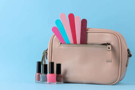 Stylish fashionable pink bag and women's cosmetics and accessories on a bright trendy naked background. female accessory concept.の写真素材
