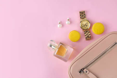Stylish fashionable pink bag and women's cosmetics and accessories on a bright trendy pink background. female accessory concept. top viewの写真素材