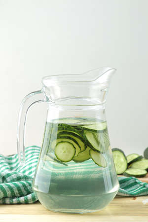 water with cucumber. Refreshing diet water with cucumber and mint in a glass beaker against a blue background. detox drink concept. summer refreshing drink. top viewの写真素材