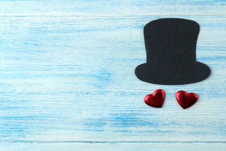 happy father's day. decorative men's hat and hearts on a light blue wooden background. top viewの写真素材