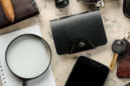 Men's Accessories. men's style. Smartphone, wallet, flask, keys, business card, and perfume on a...