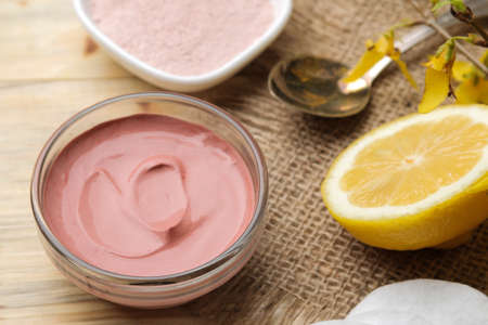 Cosmetic clay. Pink cosmetic clay in different types on a natural wooden table. face mask and body. care products. spa.の写真素材