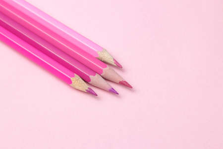 composition with pink pencil on a bright trendy pink background. top view. space for textの写真素材