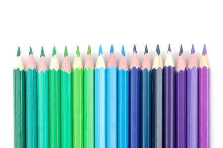 Many color pencils on white isolated background. close-up. stationery.の写真素材
