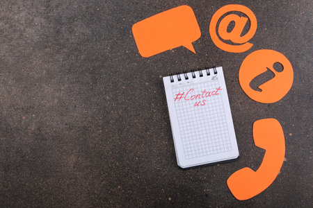 client support service. Contact us for feedback. Desktop with notepad and various feedback icons....