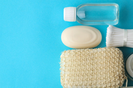 Personal hygiene products. Body care cosmetics. White bottles and vials on a blue background. SPA...