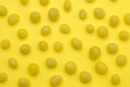 The concept of minimalism. background of delicious bright yellow sweets on a bright yellow...
