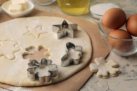 Cooking delicious cookies and rolled dough. ingredients, eggs, butter, milk and baking tins on a...