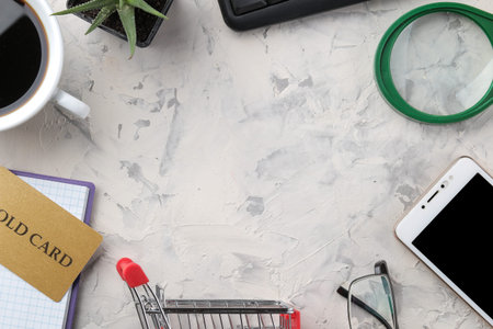 The concept of online shopping. Composition with discount cards and telephone on a light background....