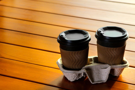 coffee to go. Coffee paper cups on a stand in a coffee shop.の写真素材