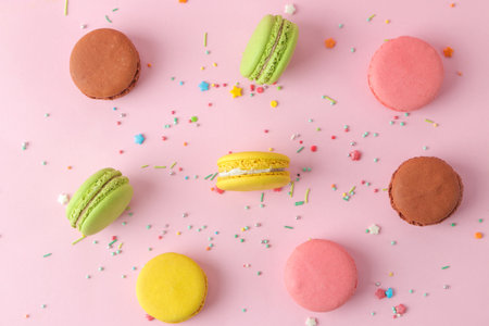 Macaroons on a pink background. Sweet French cake, different types of macarons.の写真素材
