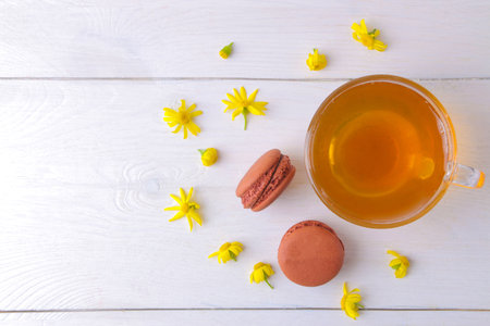 Macaroons and tea on a light background. Sweet French cake.の写真素材