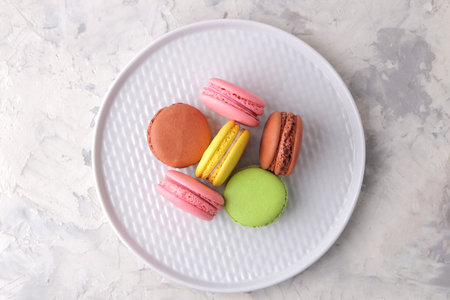 Macaroons on a light background. Sweet French cake, different types of macarons.の写真素材