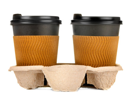 coffee to go. Several paper coffee cups on a stand on a white isolated background.の写真素材