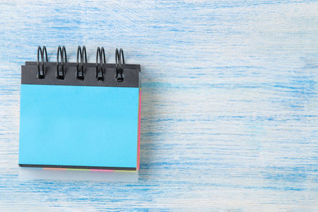 blue various notes post-  on wooden office table background .mockupの写真素材