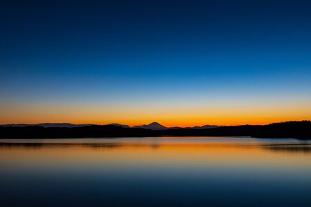 Beautiful sunset reflected in the Sayama lake in Japanの写真素材