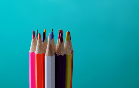 Colored pencils on a green background