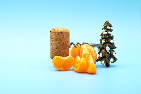 New Years composition of tangerines, corkscrew and corkの写真素材