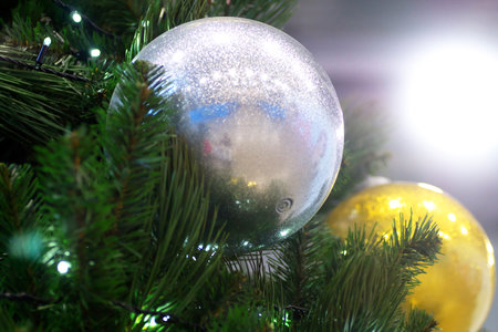 Christmas balls on a Christmas tree in a large trading hallの写真素材