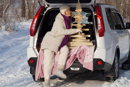 A woman and an eco spruce in the trunk of a carの写真素材
