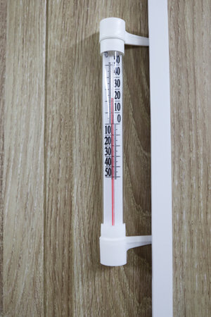 The home thermometer shows the average air temperatureの写真素材
