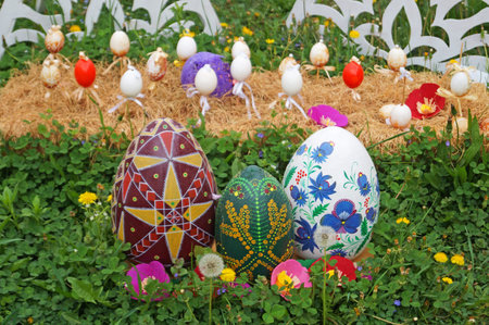 Decorative Easter eggs made of ribbons, threads and fabric at the Easter fair on a spring day