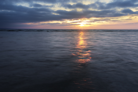 sunrise on the water / Early summer morning bright sky Beachの写真素材