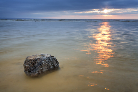 stone won at dawn / bright summer photo early spring Ukraineの写真素材