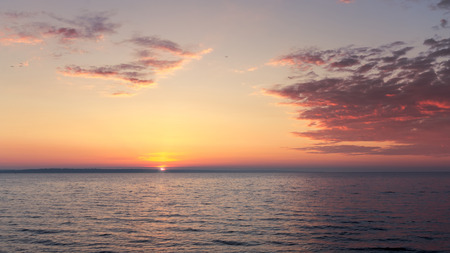 colorful dawn on the river / Cumulus clouds over water Ukraine early springの写真素材