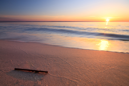 sunlight sunrise on the shore / early spring warming sunの写真素材