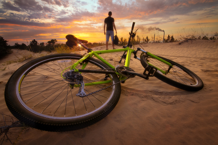 man meets sunset / the man looks into the sunsetの写真素材