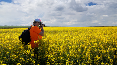 photographer in search of a story / photo hike rapeseed field story searchの写真素材