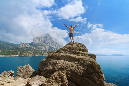 man on top of the hill / the joy of traveling natural beautyの写真素材