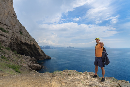 man standing on the mountainの写真素材