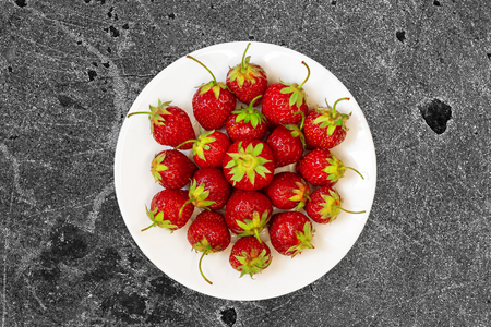 strawberries on dish / bright juicy berry close-upの写真素材