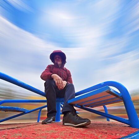 the man on the carousel / abstract photo of blurred background rotationの写真素材