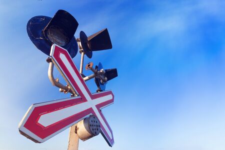 railway sign / sign in perspective against the skyの写真素材