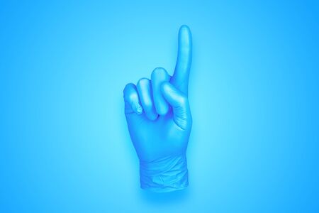 rubber glove isolated on background / abstract background photoの写真素材