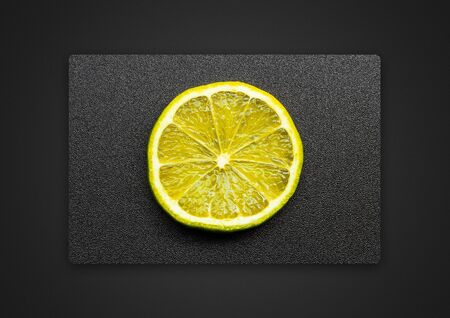 lemon on a grey background / Passepartout background photoの写真素材