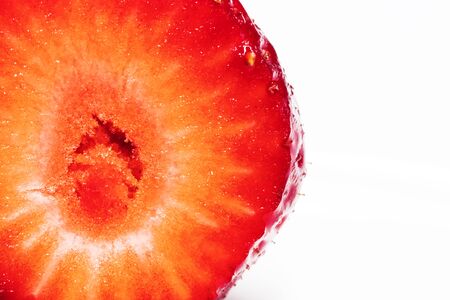 strawberry close-up / on a white plate backgroundの写真素材