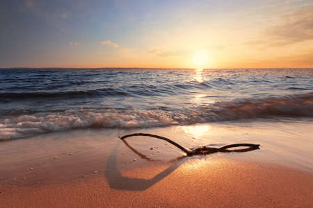 sunrise on the water / Early summer morning bright sky Beachの写真素材