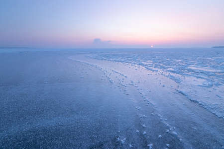 a bright winter morning landscape, soft removable warming sun rays heatの写真素材